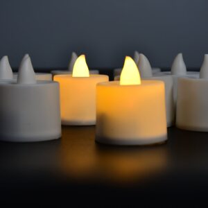 Yellow LED tealight candle set with white containers